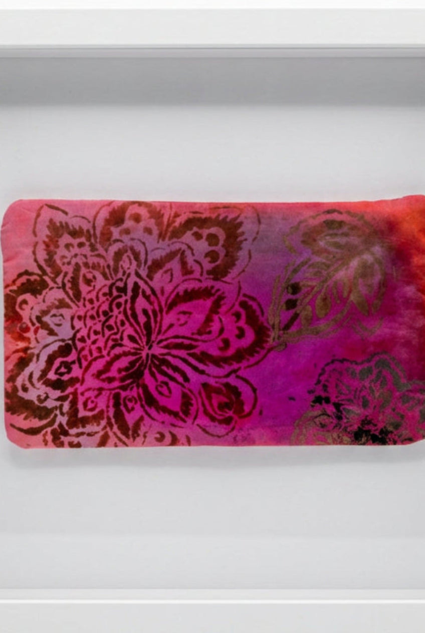 A rectangular fabric pouch with a pink and magenta floral damask pattern.
