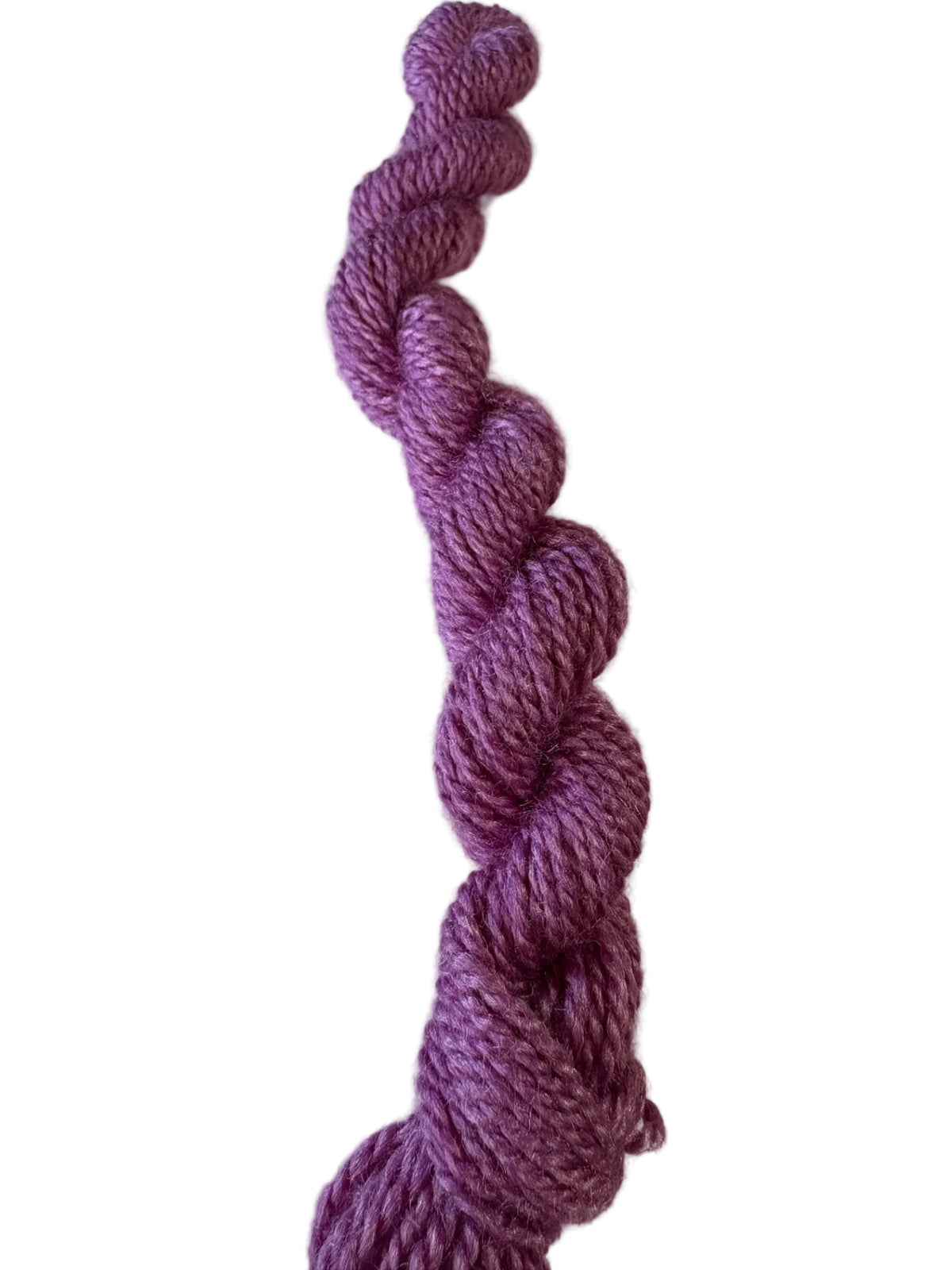A single skein of twisted yarn in a heathered purple color, photographed vertically against a plain off-white background.