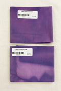 Two folded square pieces of purple indigo-dyed cotton fabric with white price labels, displayed on a white surface.