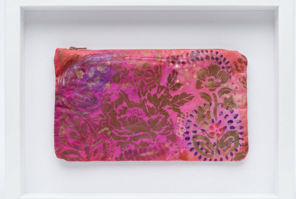 A rectangular zippered pouch with a vibrant pink and brown floral damask pattern.